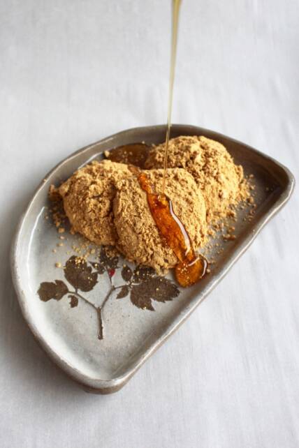 Kinako dusted mochi drizzled with maple syrup.