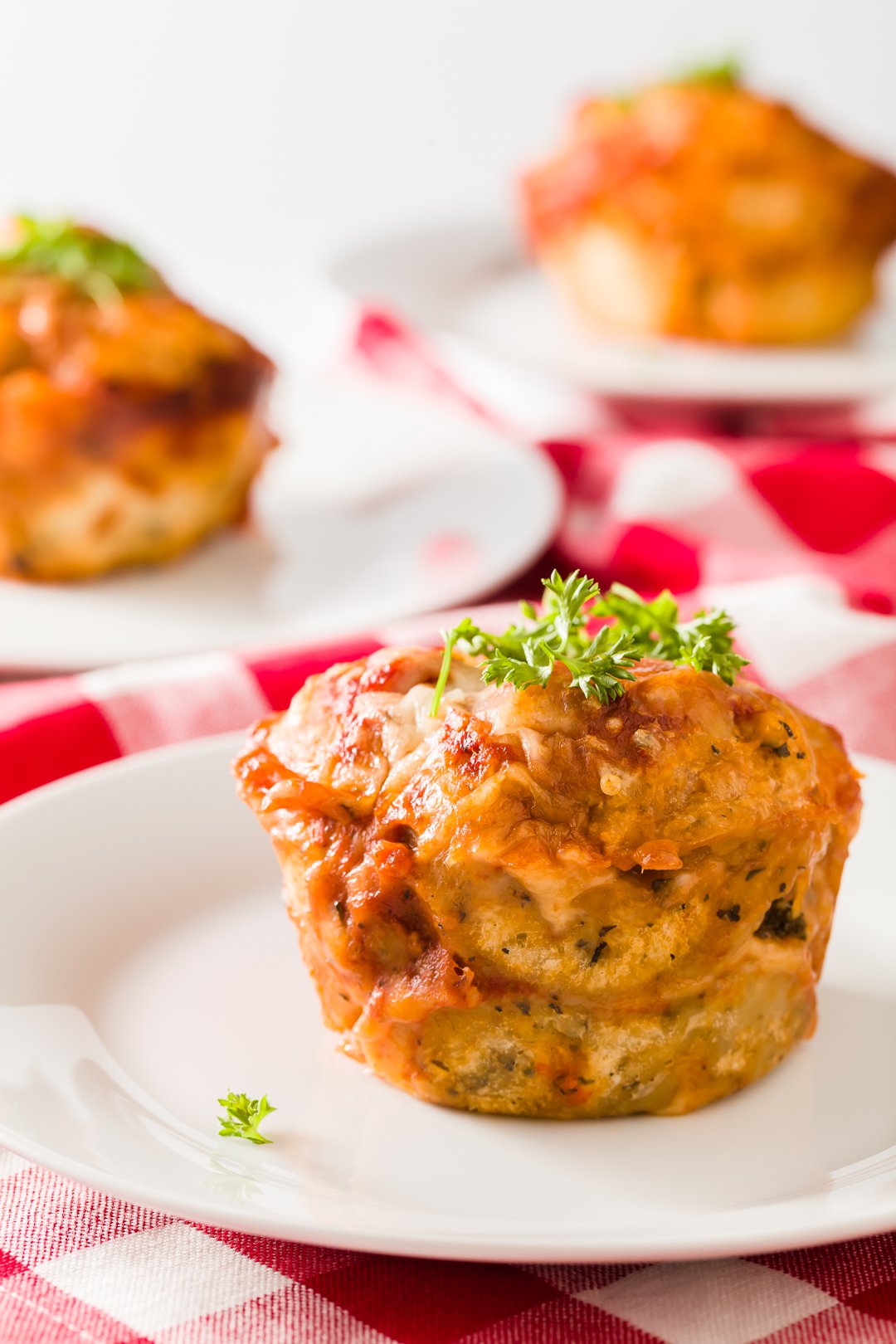 Several plates of pizza muffins