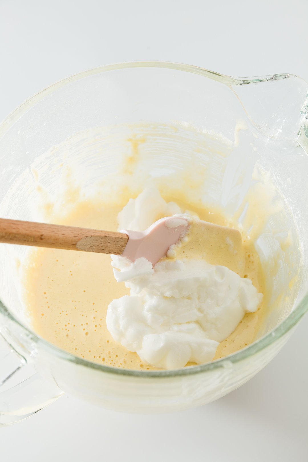 folding egg whites into tres leches cake batter