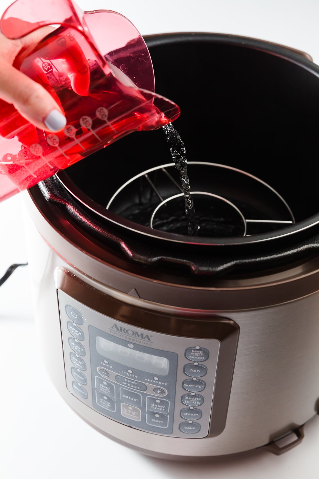 Adding water to a pressure cooker