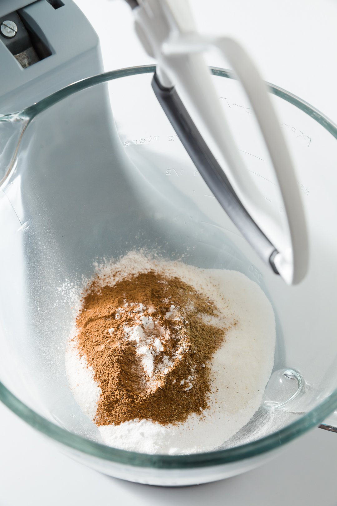 Adding spices to carrot cake batter