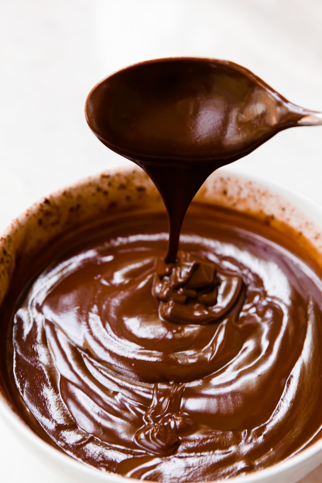 Ganache dripping from a spoon