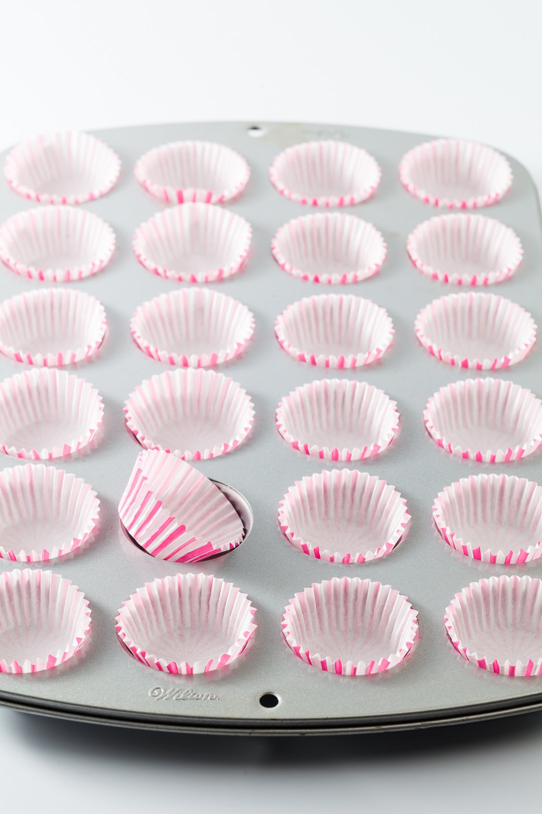 mini cupcake tin filled with 24 liners