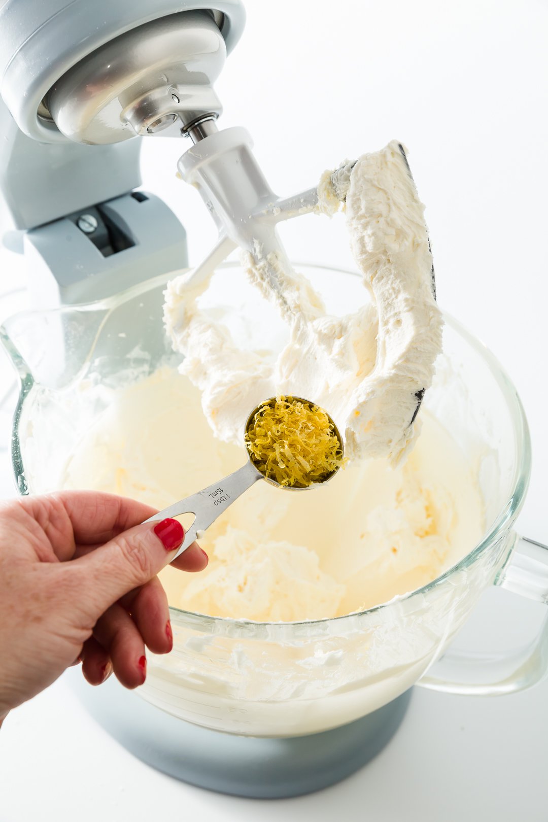 Adding lemon zest to lemon buttercream frosting