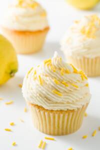 Several cupcakes frosted with lemon buttercream frosting
