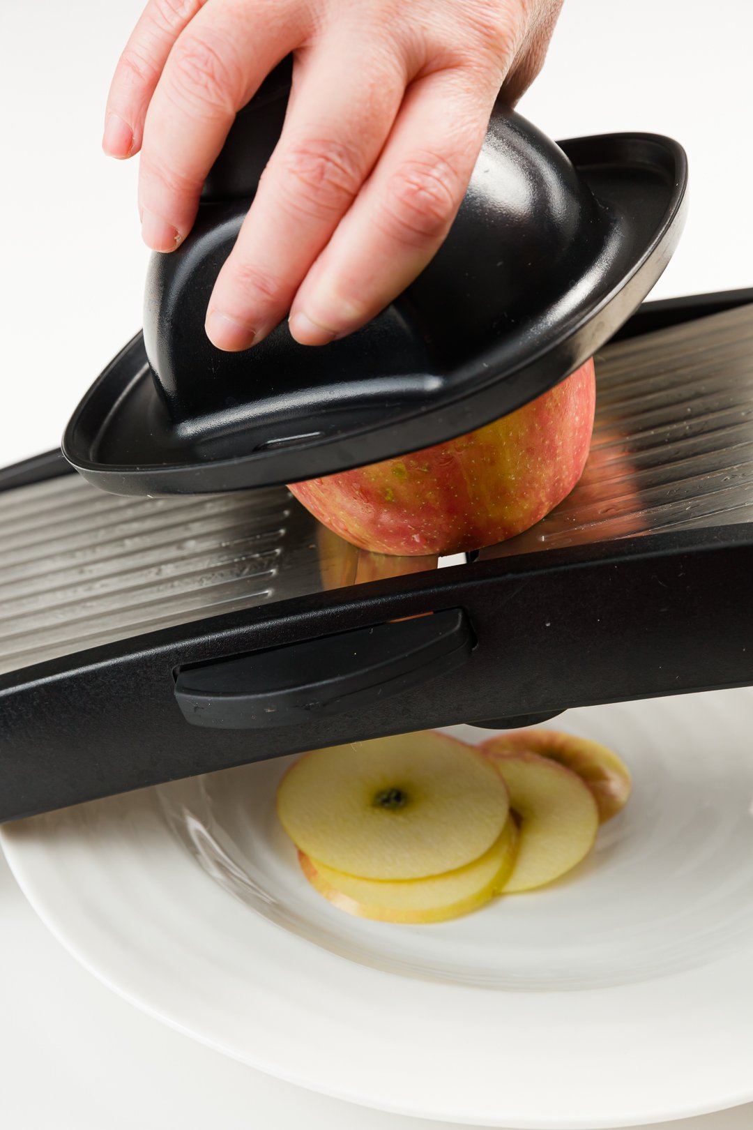 slicing apples with a mandoline