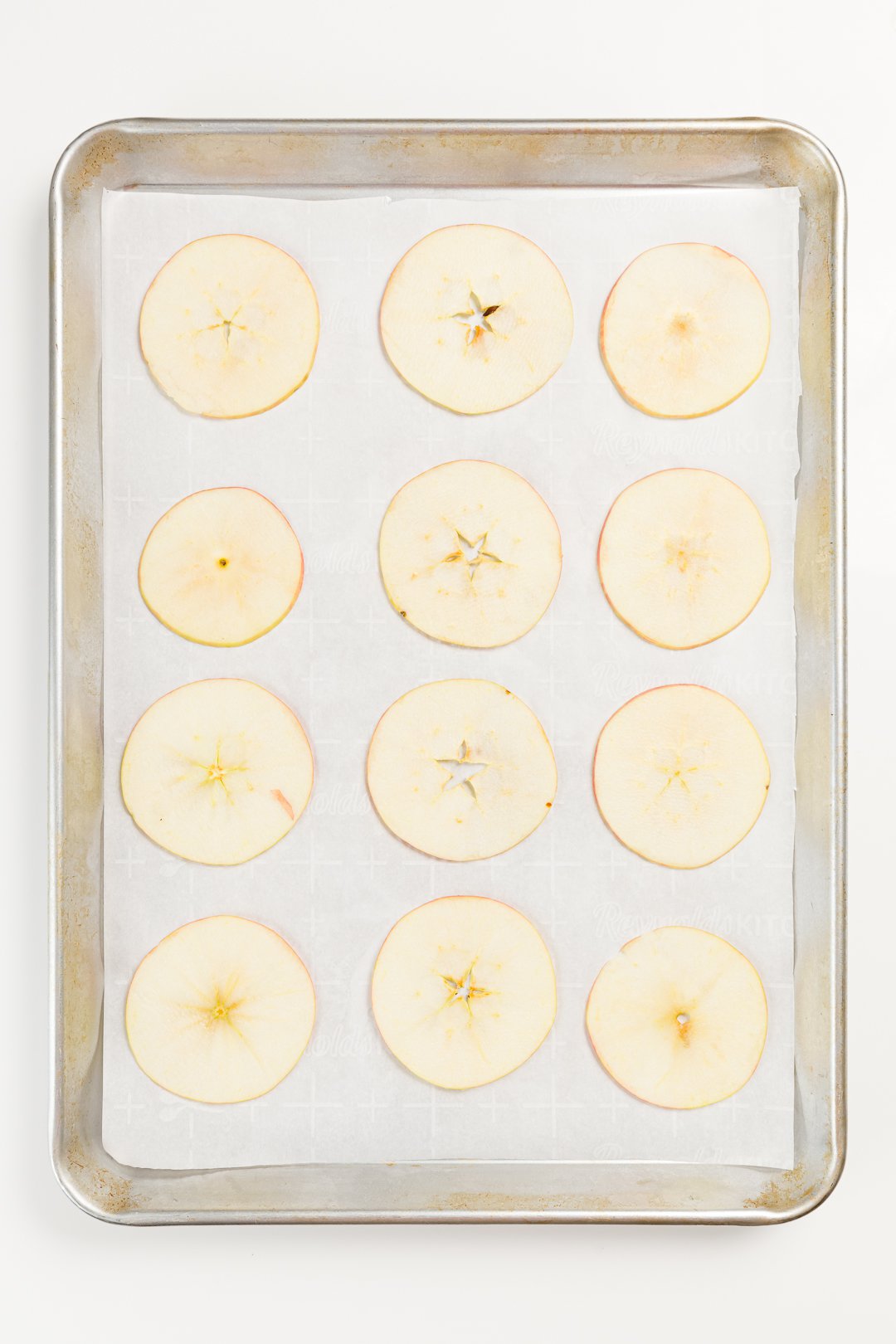 Sliced apples on parchment