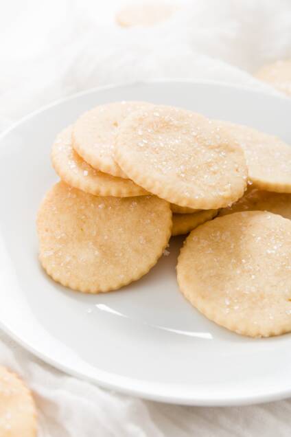 White plate filled with a pile of honey cookies