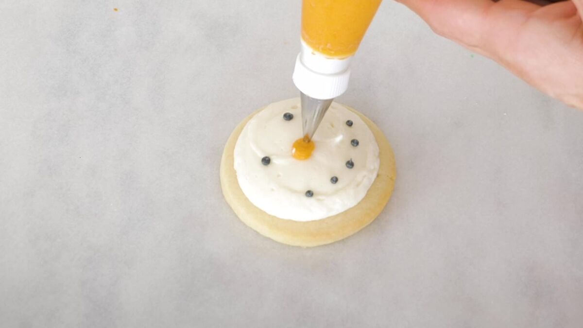 Decorating snowman cookies