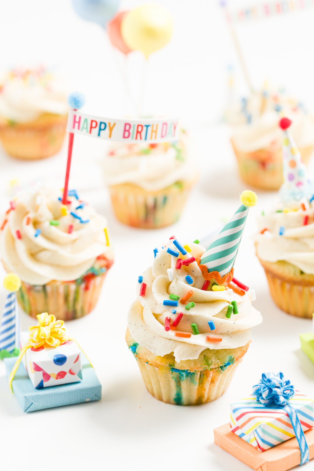 A bunch of birthday cupcakes