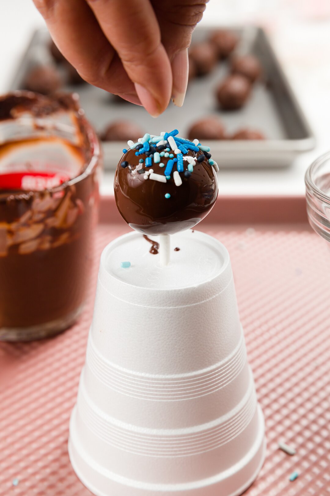 cake pops cool on a cup