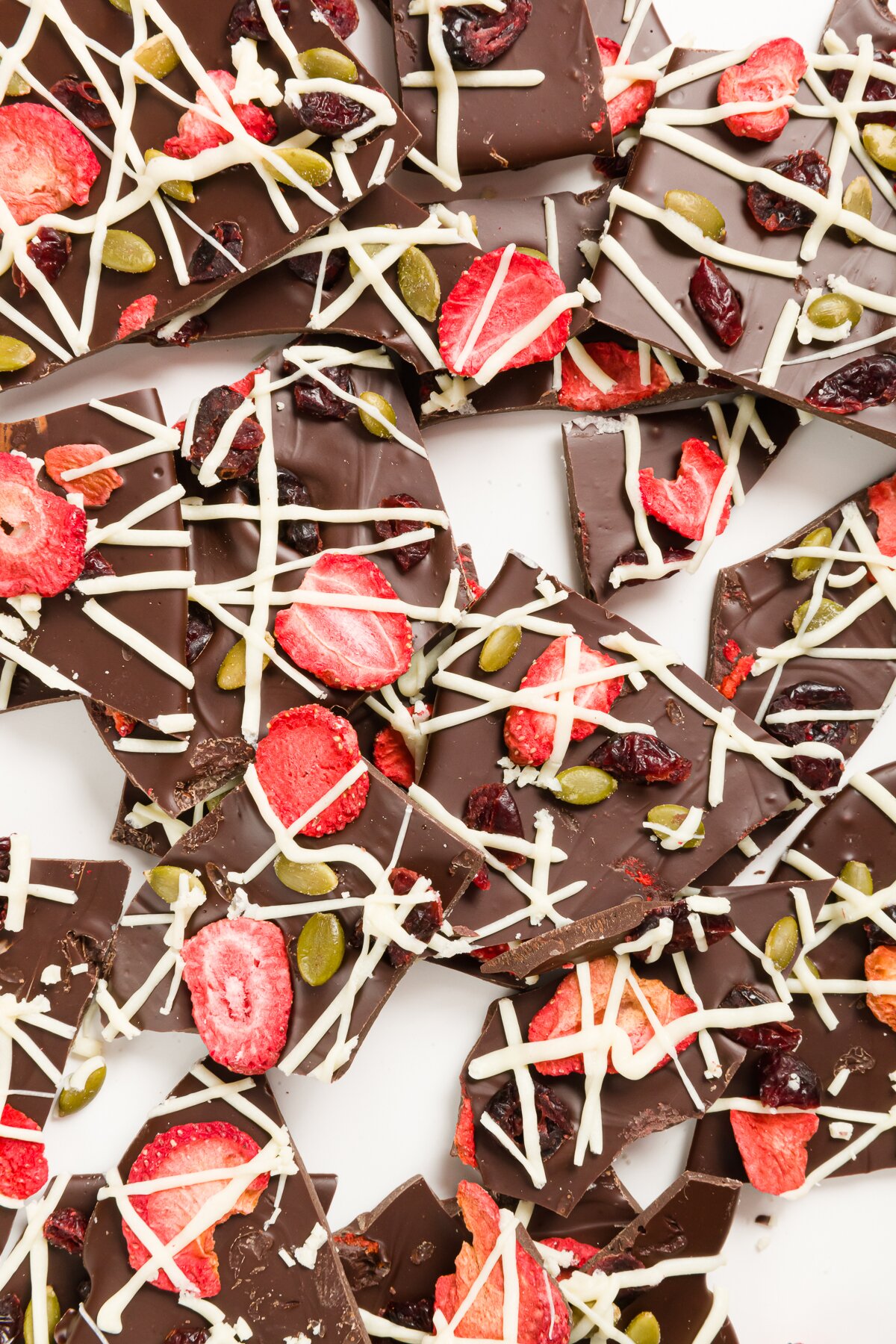 overhead shot of chocolate bark tightly spiced on a white countertop