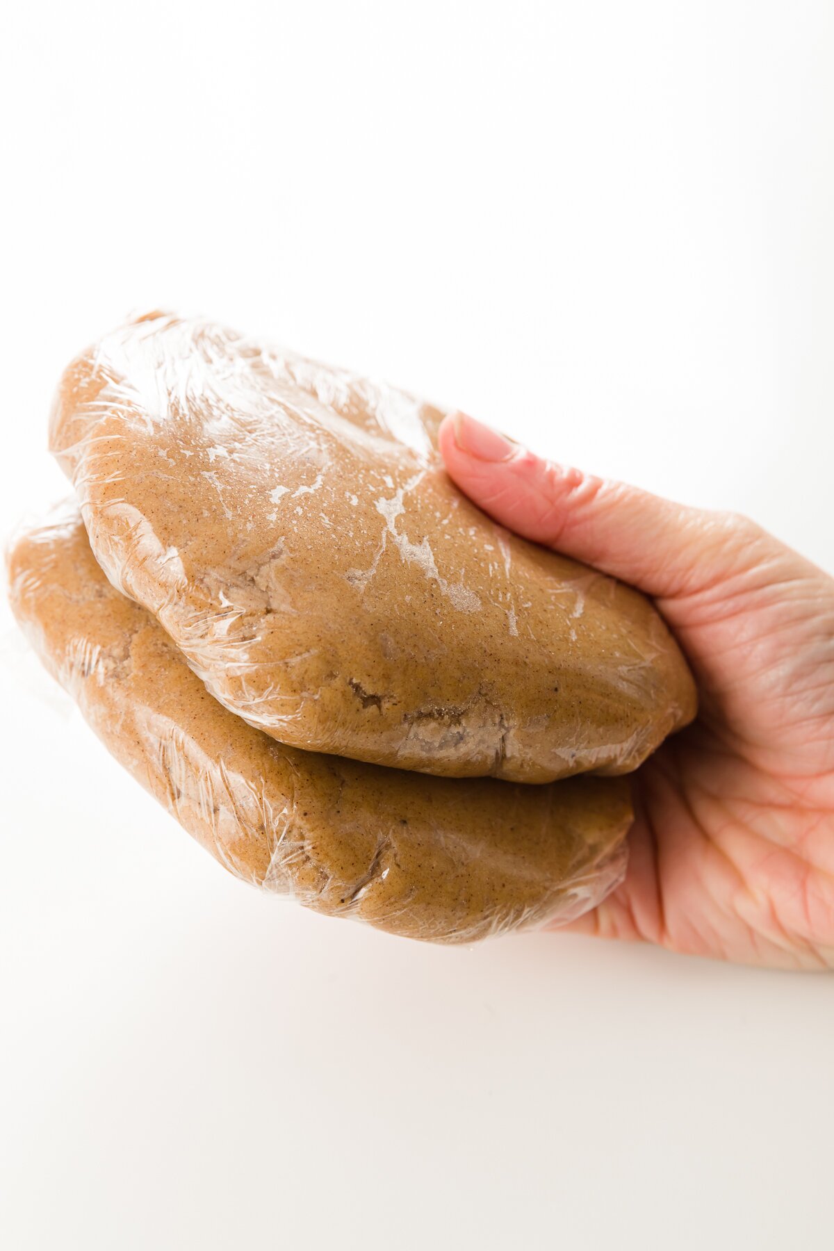 two packages of tightly-wrapped speculoos cookie dough