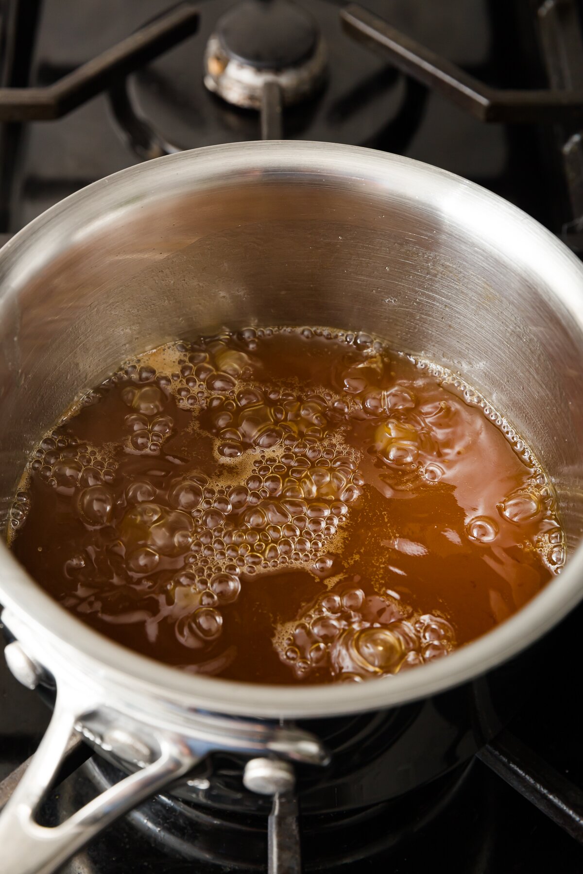 looking down into a pot with rum syrup boiling
