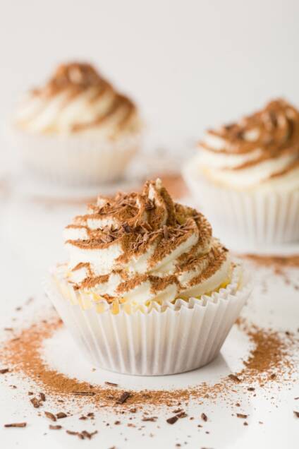 tight shot of a tiramisu cupcake with two others in the background