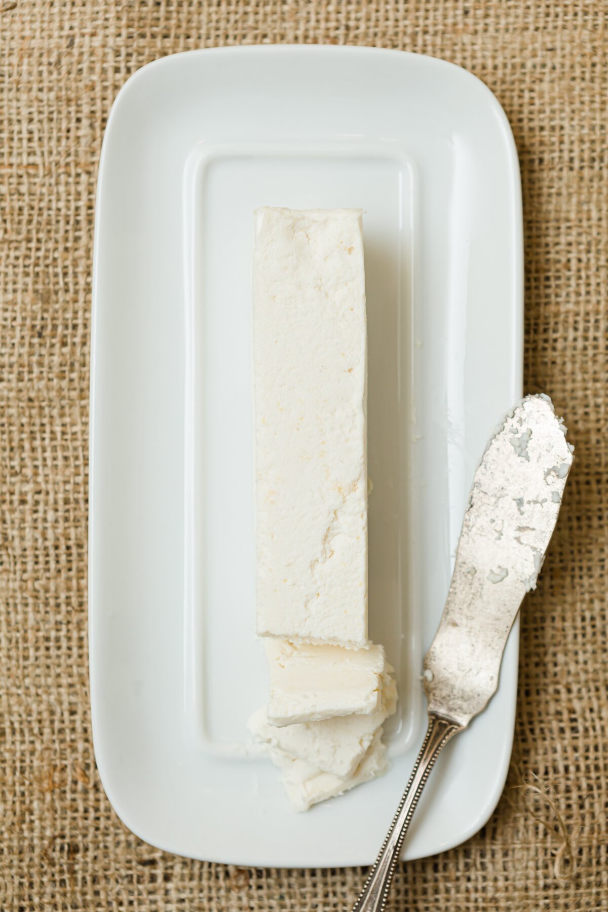 overhead view of vegan butter on a white butter dish