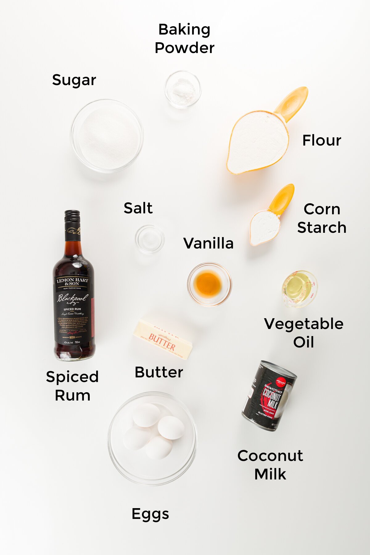 Rum cake ingredients labeled in an overhead shot