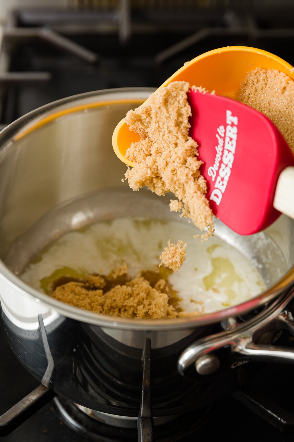 Adding brown sugar to melted butter in a pot
