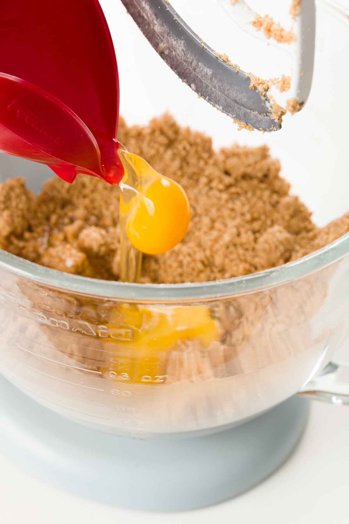 Adding eggs to brown sugar butter mixture