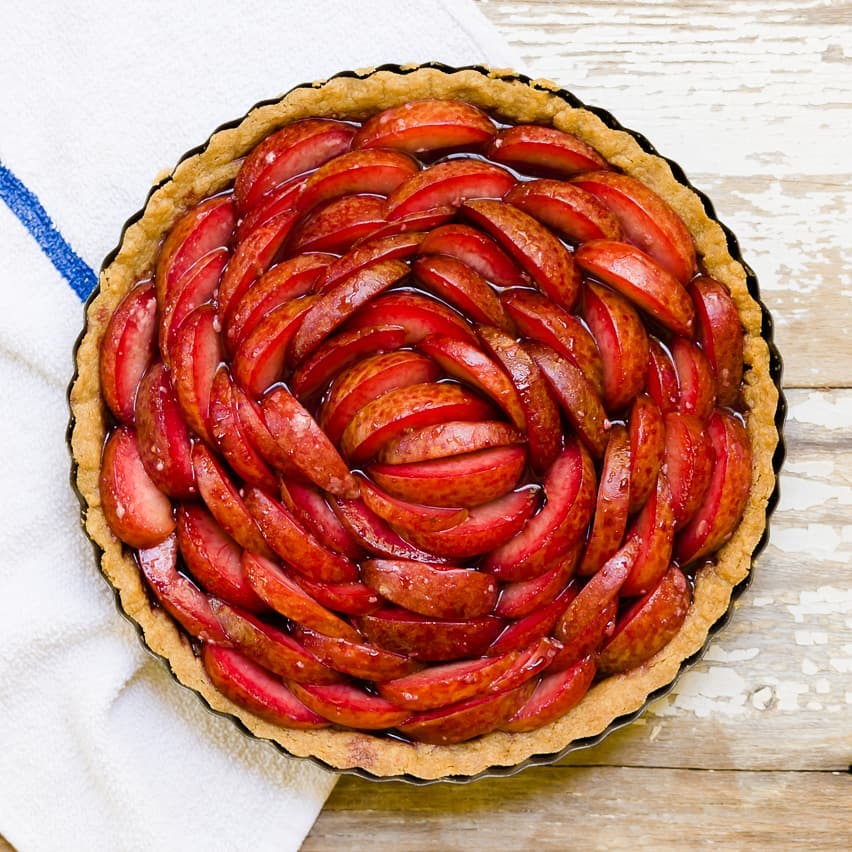 Gallery image for https://www.cupcakeproject.com/pluot-and-port-wine-tart-with-brown-sugar-crust/