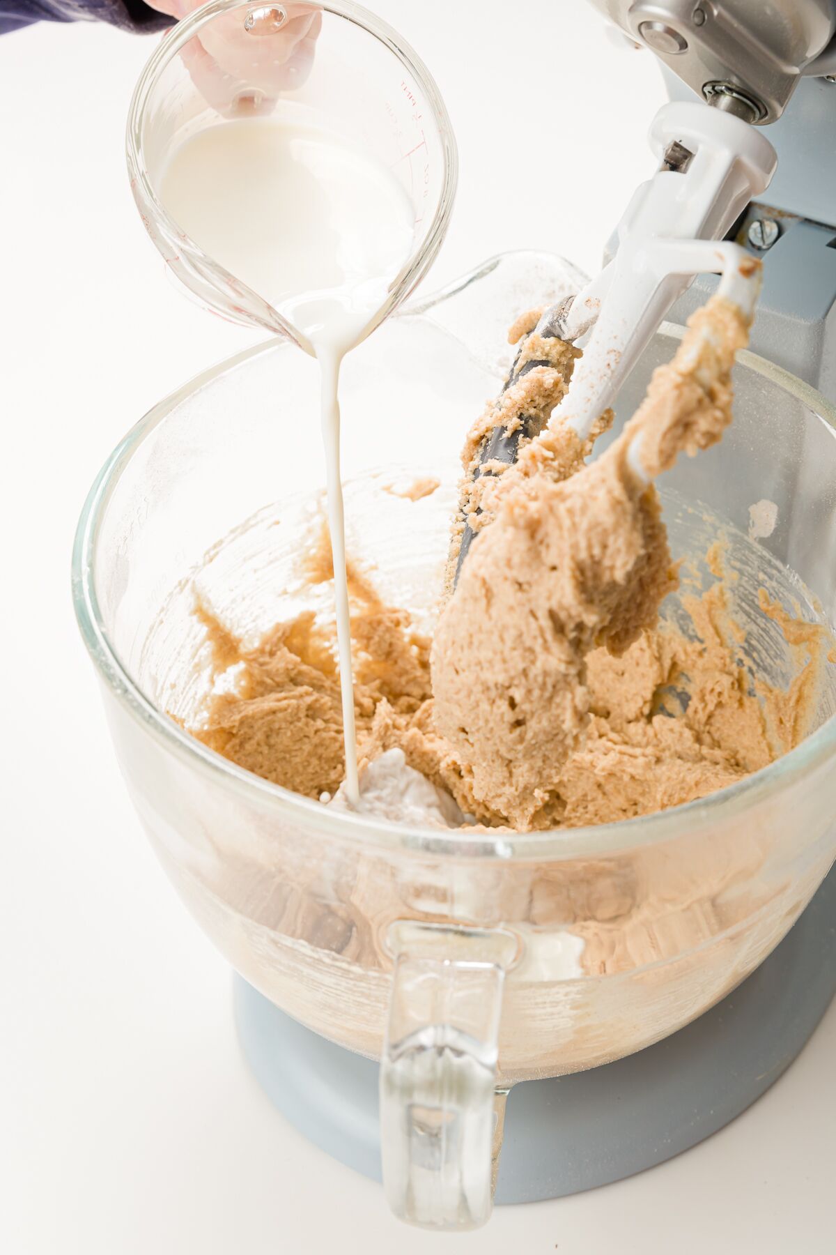 Adding milk to batter in stand mixer