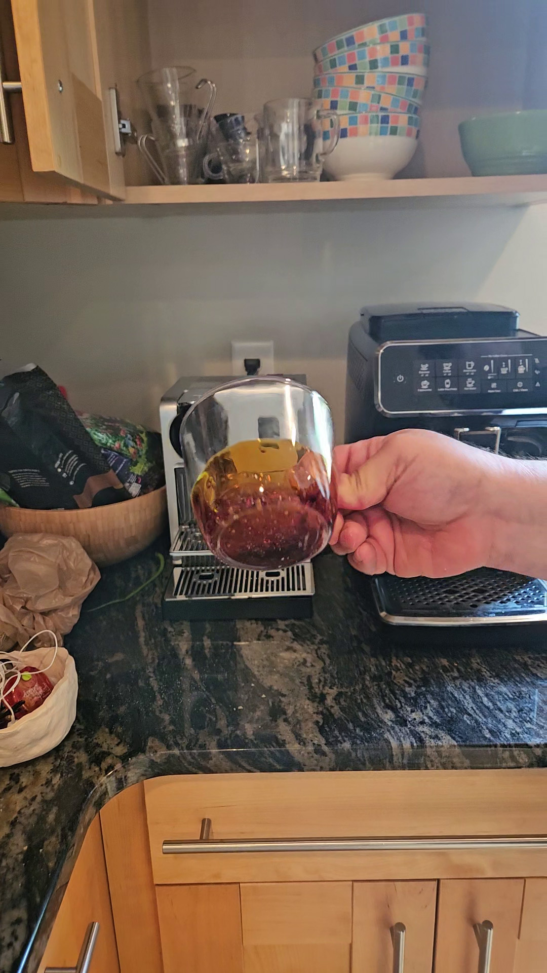 Swirling caramel sauce around the bottom of a glass mug.